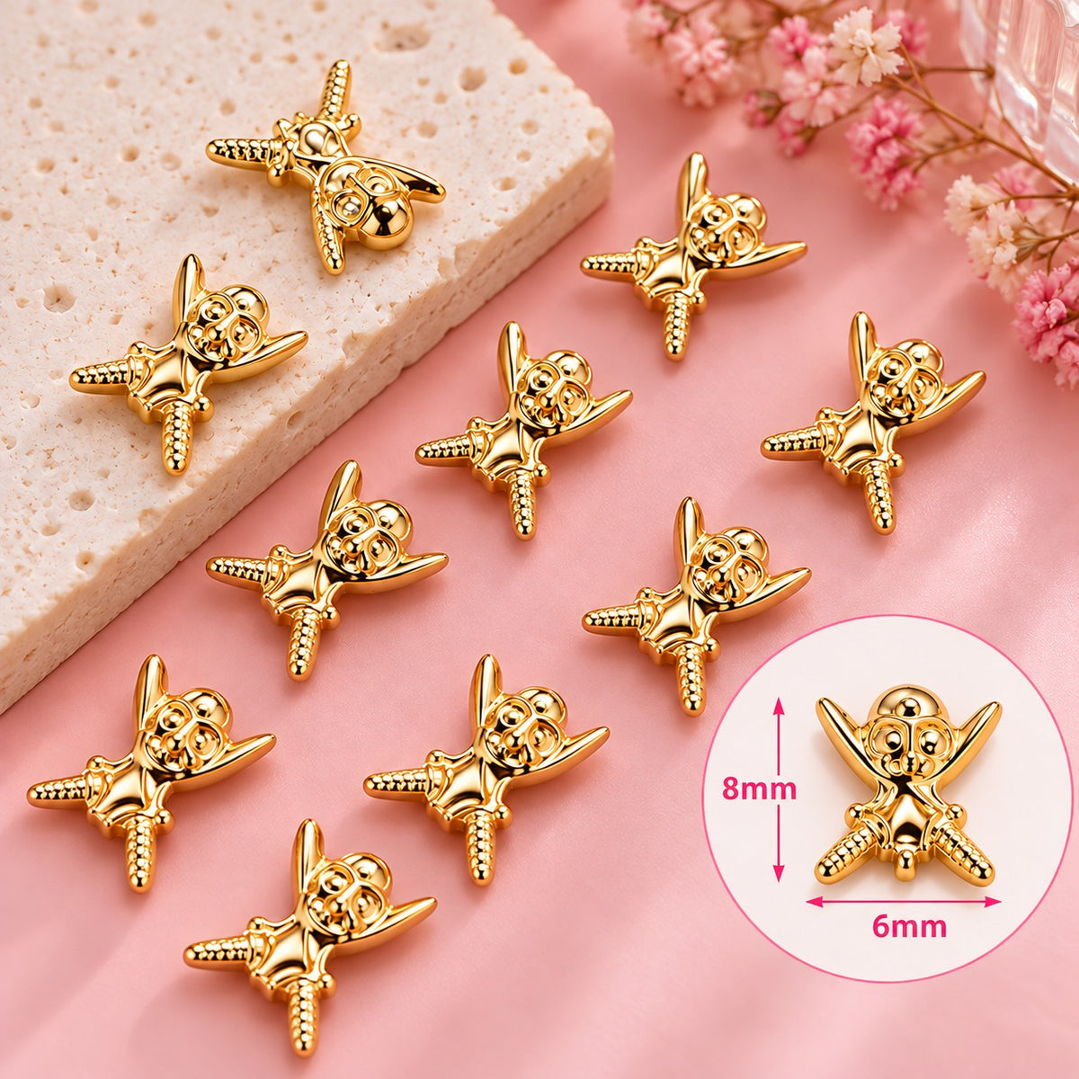 TNBL Nail Art Charm 70 - Miniature skull and crossbones (10pcs) Gold