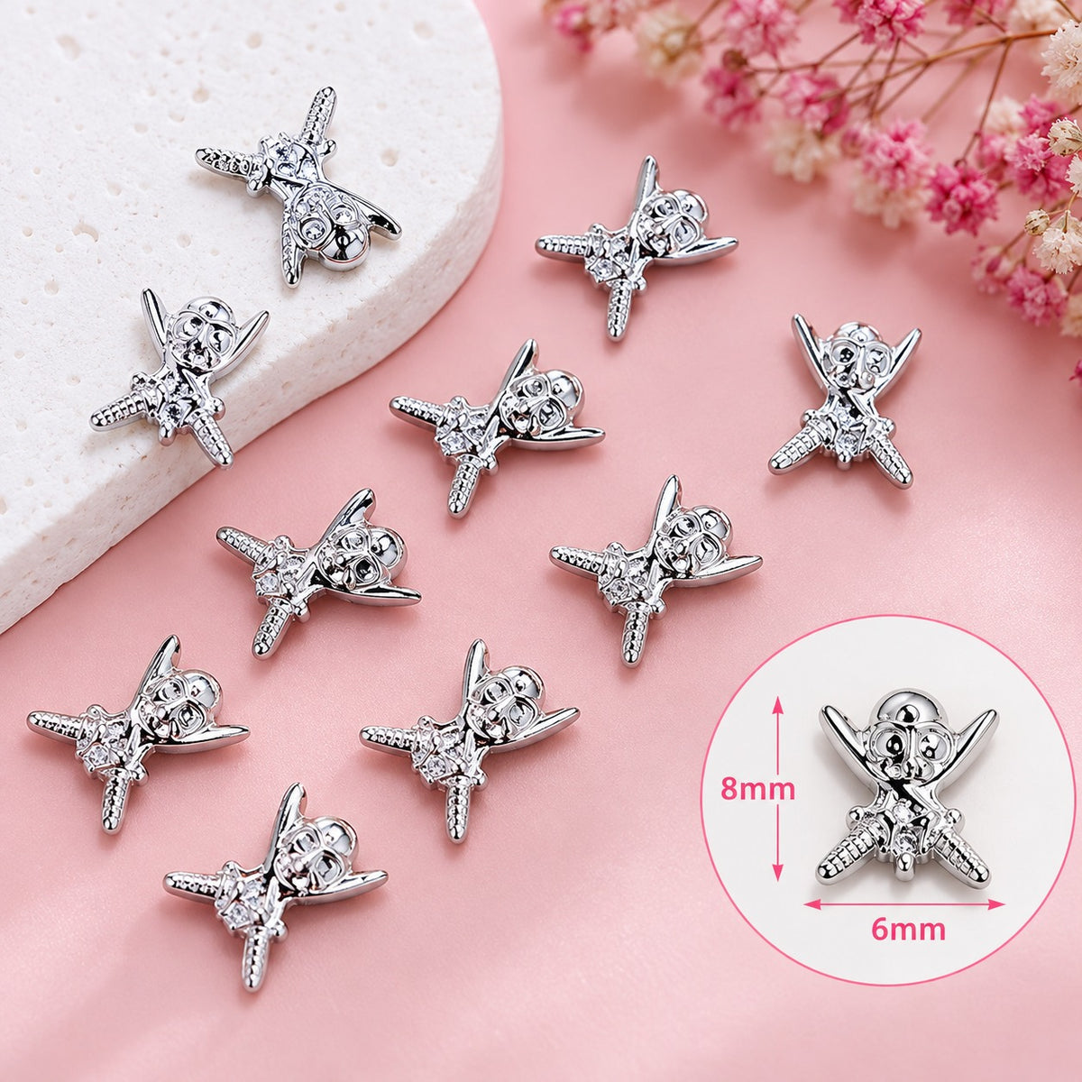 TNBL Nail Art Charm 71 - Miniature skull and crossbones (10pcs) Silver